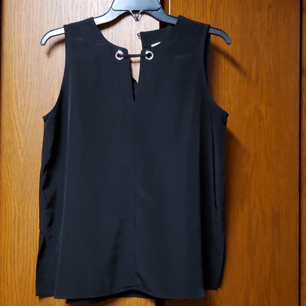 3 for $40.  Sleeveless blouse.